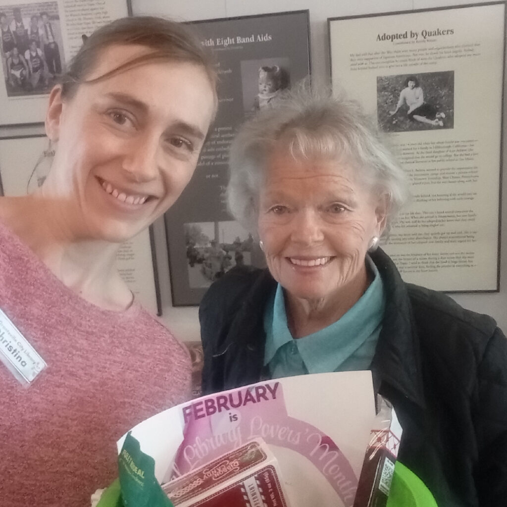 ladies donating to library